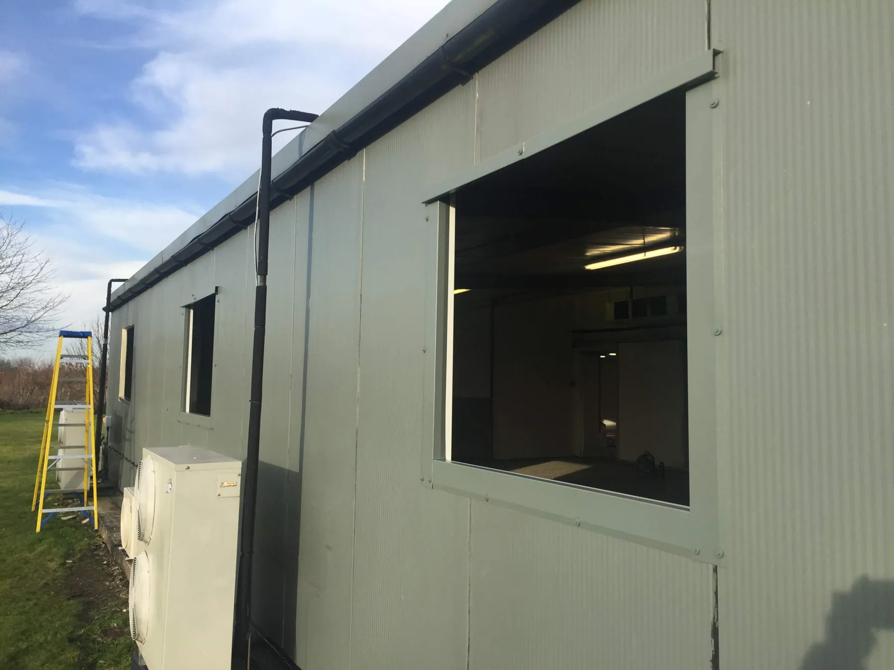 New Windows Cut into Composite Cladding, Wath, in progress